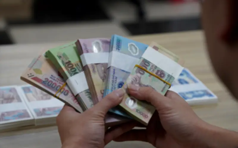 Cảnh báo rủi ro kép từ việc đổi tiền mới, tiền lẻ trái phép dịp cận Tết