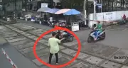 Clip hành động của người đàn ông khi barie đã hạ gây bức xúc