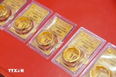 Giá vàng thế giới giảm 0,25% sáng 22/6 do áp lực từ Fed và USD mạnh